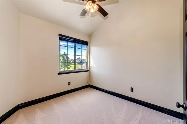 a bathroom with a toilet a sink and a mirror