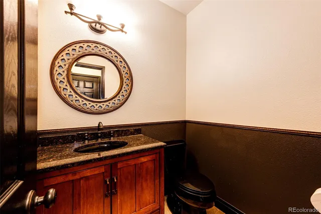 an empty room with wooden floor and natural light
