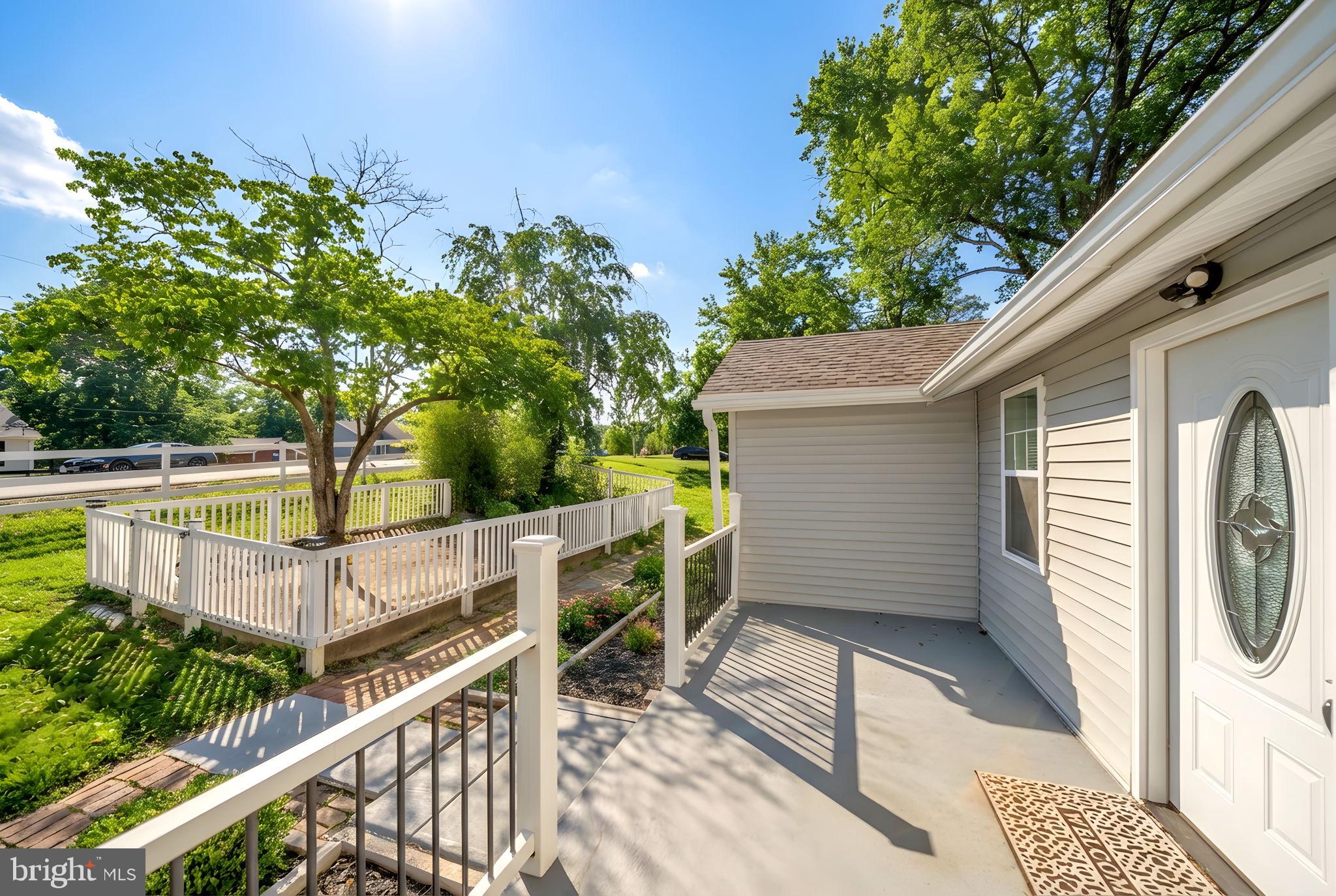 671 Pine Ridge Drive Front Royal, VA 22630 - Photo 15 of 108 Charming home with lush greenery and sunlight.