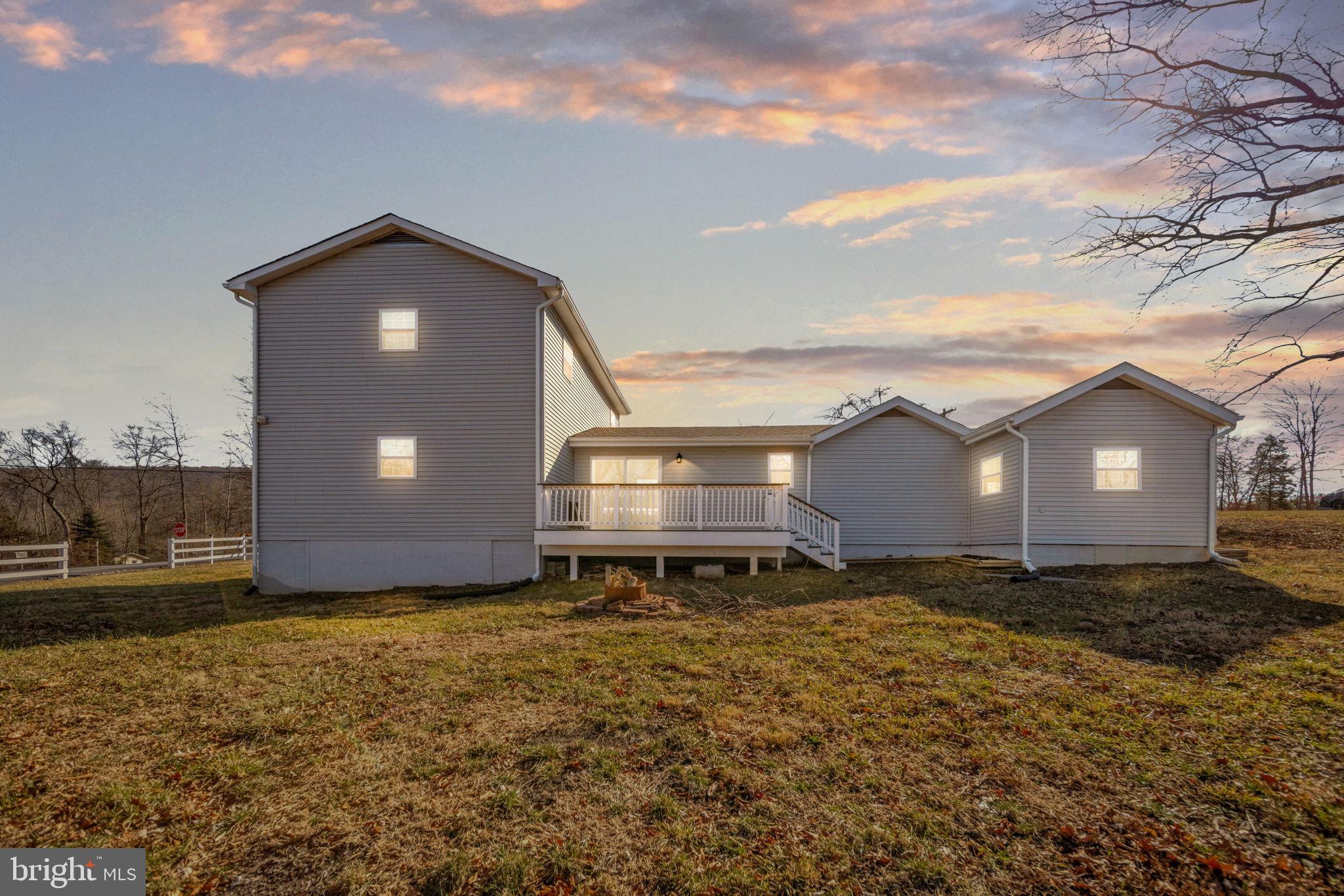 671 Pine Ridge Drive Front Royal, VA 22630 - Photo 22 of 108 Charming home bathed in golden sunset glow.