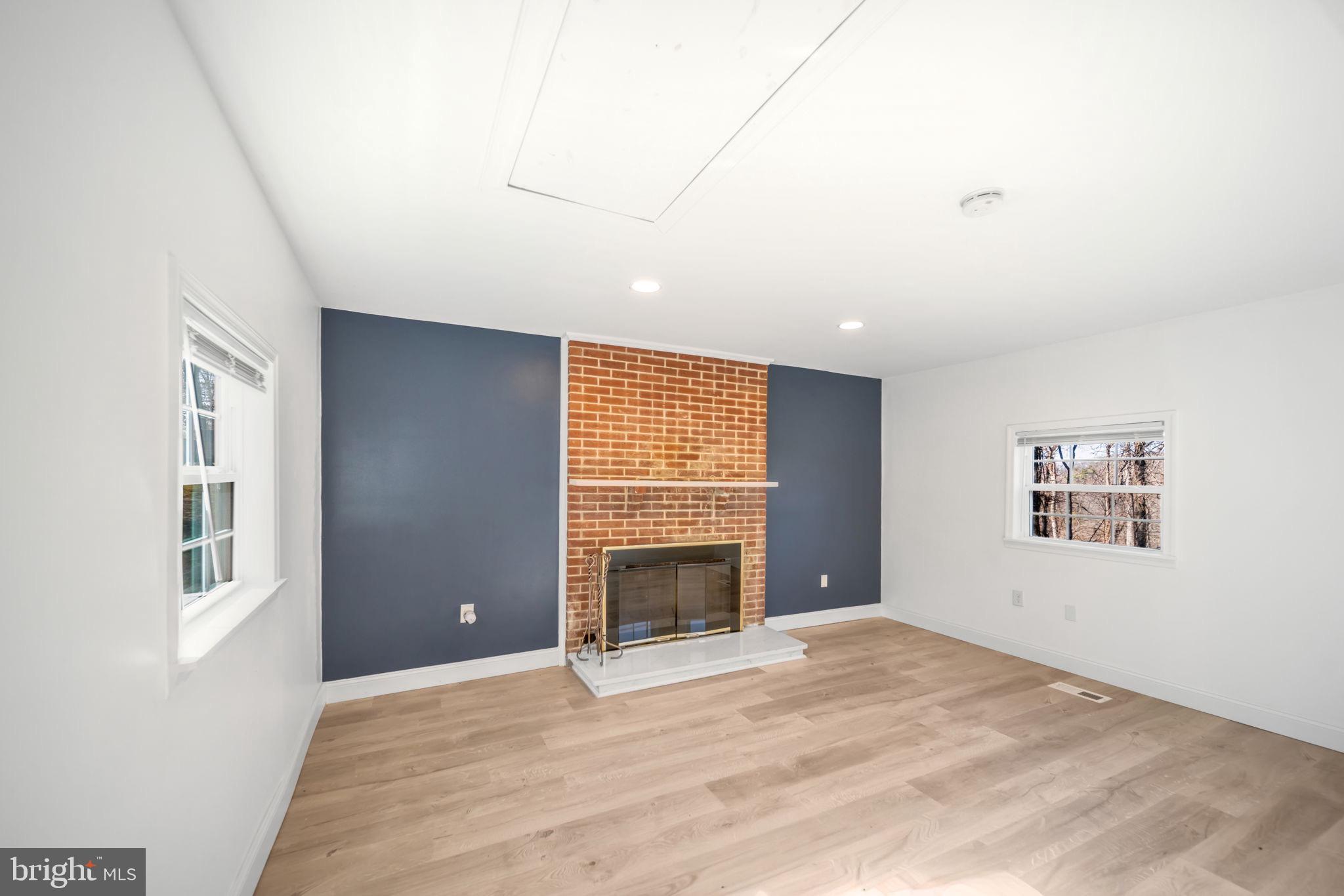 671 Pine Ridge Drive Front Royal, VA 22630 - Photo 46 of 108 Bright and airy space with a cozy fireplace.