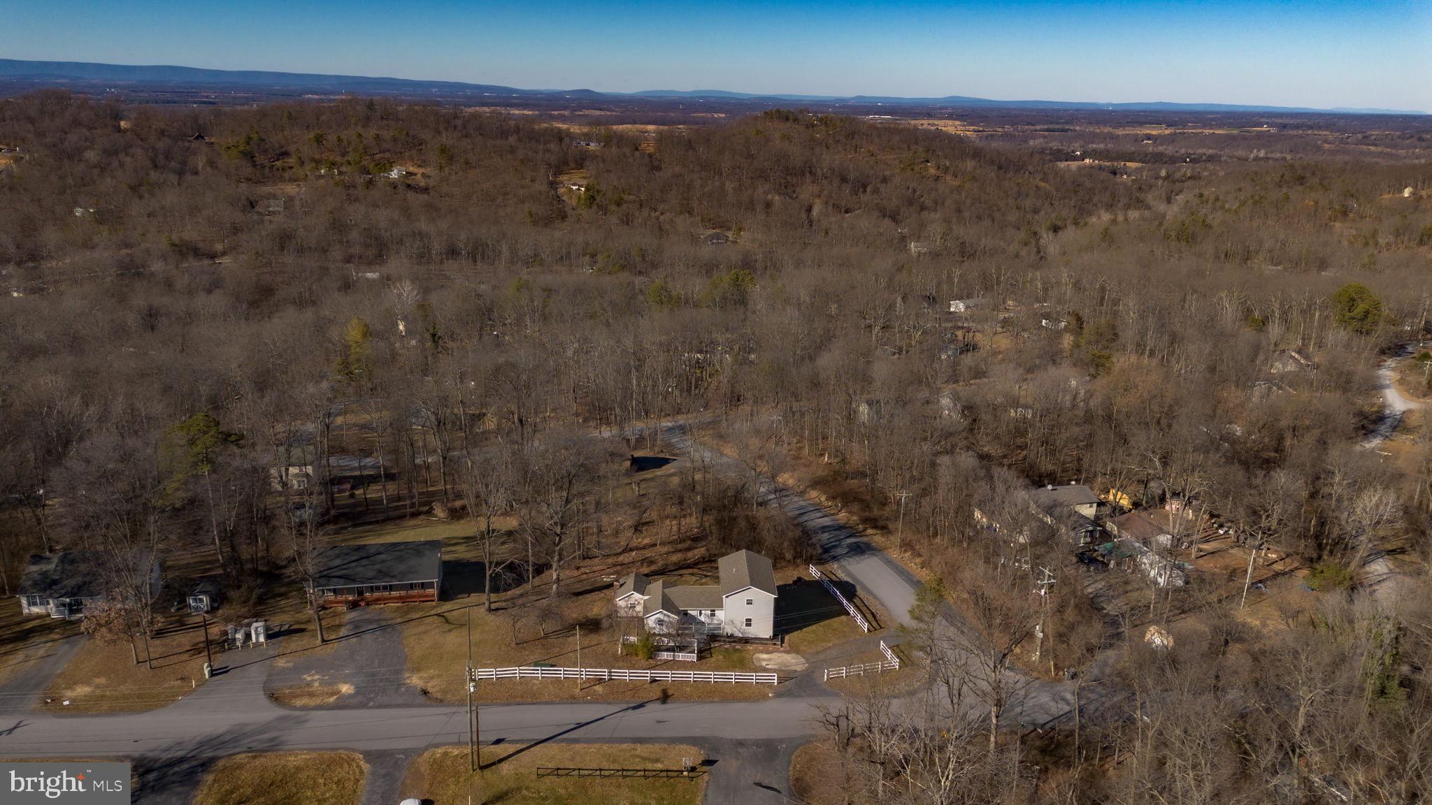 671 Pine Ridge Drive Front Royal, VA 22630 - Photo 94 of 108 Serene landscape with winding roads and trees.