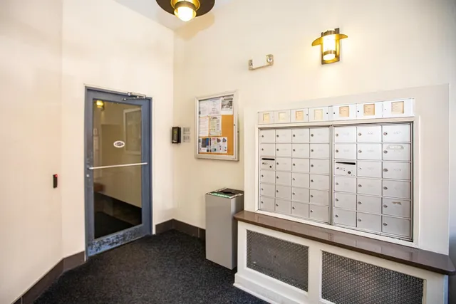a kitchen with granite countertop a sink and cabinets