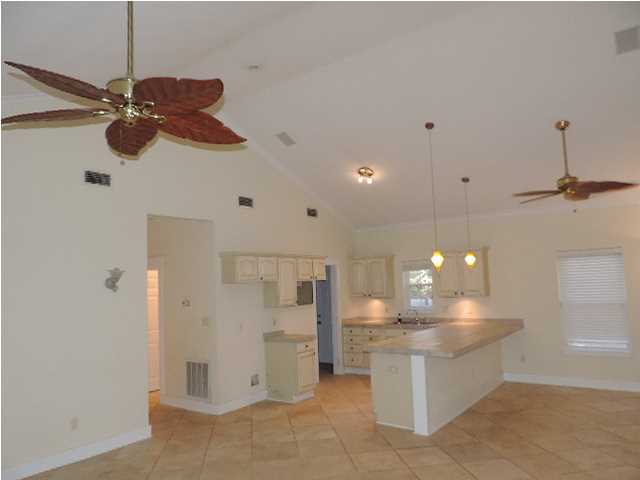 1102 East Nursery Road Santa Rosa Beach, FL 32459 - Photo 2 of 11 a view of a kitchen with a chandelier