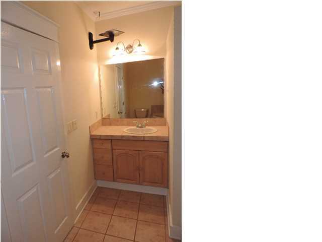 1102 East Nursery Road Santa Rosa Beach, FL 32459 - Photo 9 of 11 a bathroom with a sink and a mirror