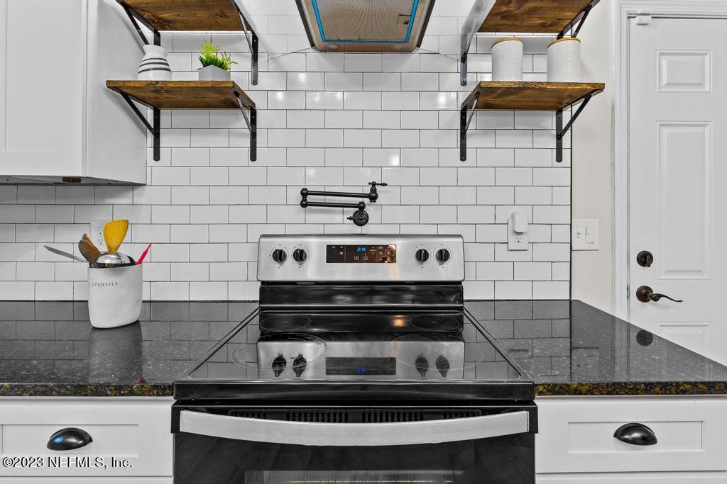 4635 Attleboro Street Jacksonville, FL 32205 - Photo 14 of 27 a stove top oven sitting inside of a kitchen