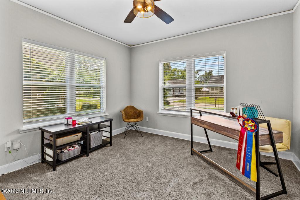 4635 Attleboro Street Jacksonville, FL 32205 - Photo 19 of 27 a room with furniture and a window