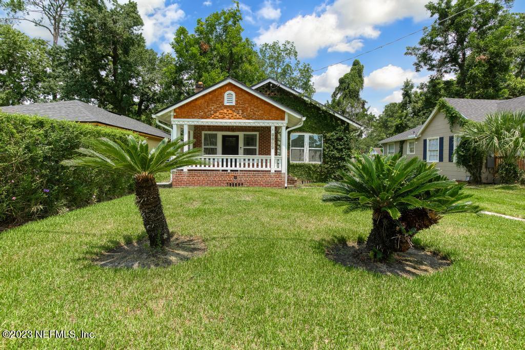 4635 Attleboro Street Jacksonville, FL 32205 - Photo 2 of 27 a front view of a house with a yard