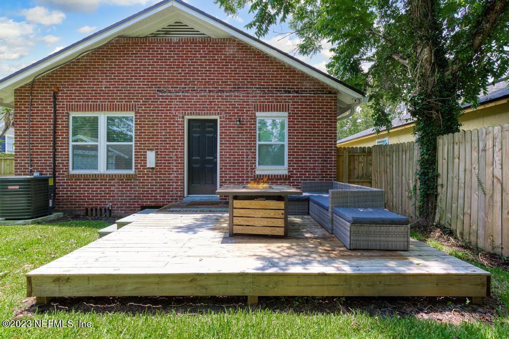4635 Attleboro Street Jacksonville, FL 32205 - Photo 21 of 27 a front view of a house with a garden