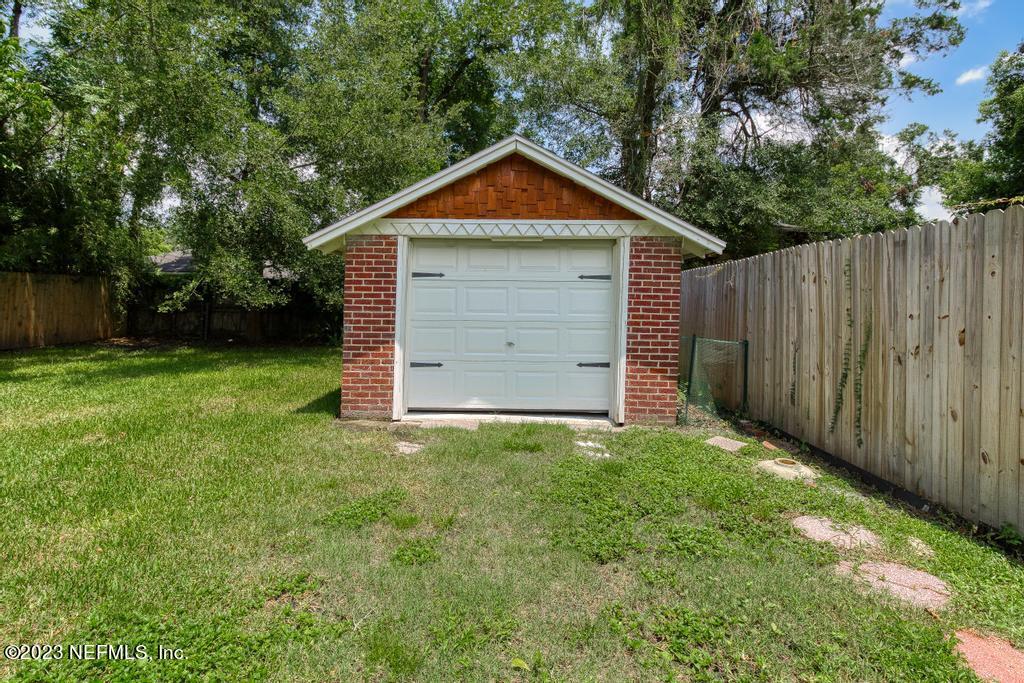 4635 Attleboro Street Jacksonville, FL 32205 - Photo 26 of 27 a view of a house with backyard and trees