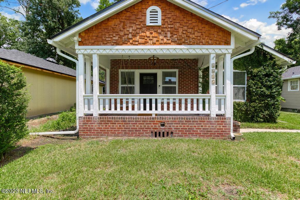 4635 Attleboro Street Jacksonville, FL 32205 - Photo 3 of 27 a front view of a house with a yard
