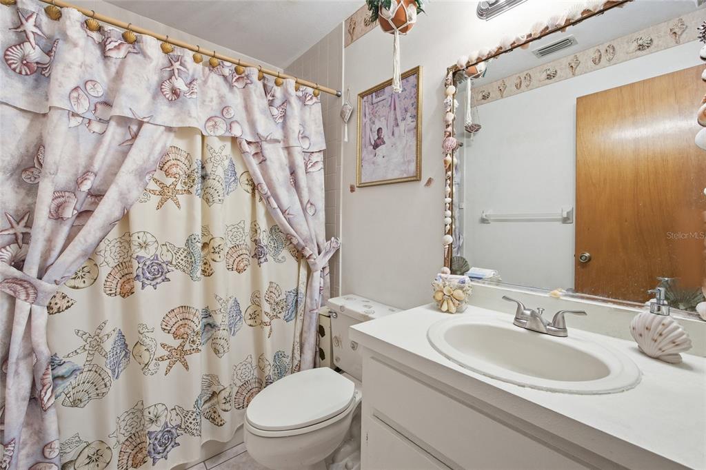 549 Silver Course Run Ocala, FL 34472 - Photo 27 of 48 a bathroom with a granite countertop sink and a mirror