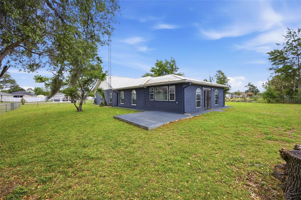 549 Silver Course Run Ocala, FL 34472 - Photo 36 of 48 a view of a house with a yard