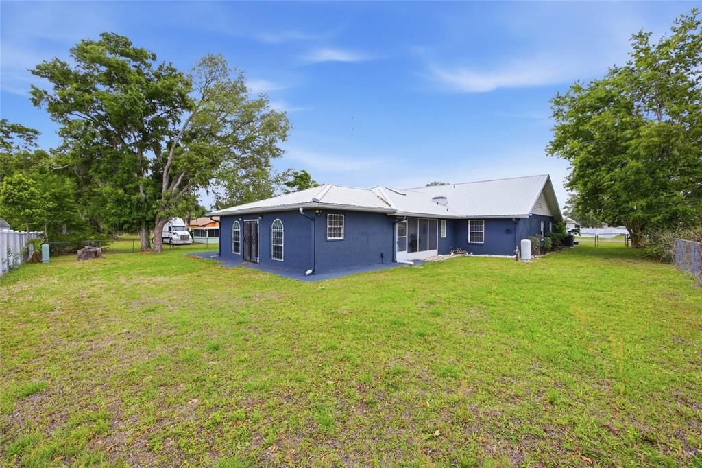 549 Silver Course Run Ocala, FL 34472 - Photo 38 of 48 a view of a house with a backyard