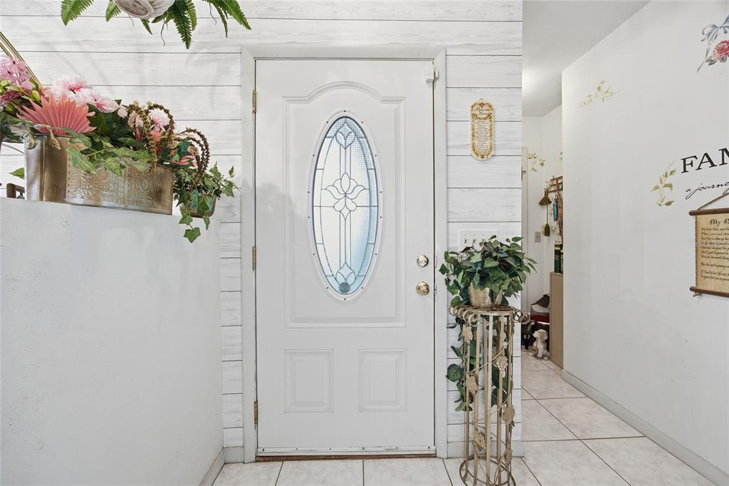 549 Silver Course Run Ocala, FL 34472 - Photo 4 of 48 a view of a entryway with flower pots