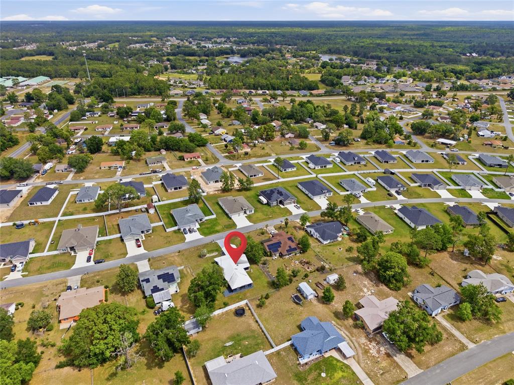 549 Silver Course Run Ocala, FL 34472 - Photo 46 of 48 an aerial view of residential houses with outdoor space
