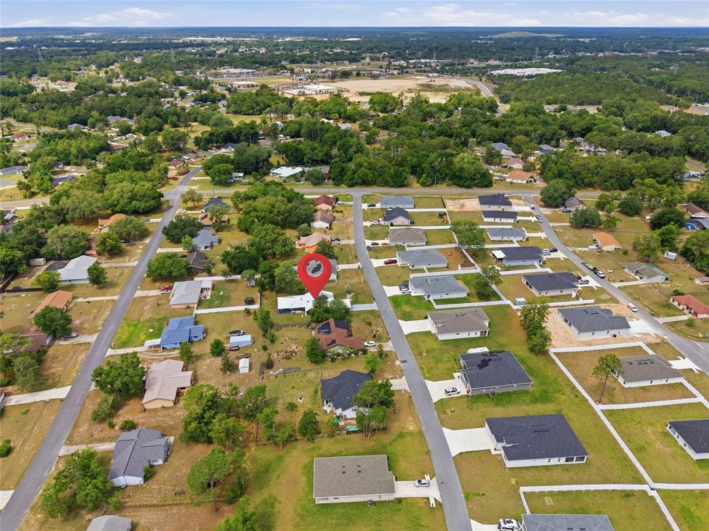 549 Silver Course Run Ocala, FL 34472 - Photo 47 of 48 an aerial view of residential houses with outdoor space