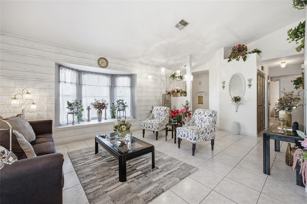 549 Silver Course Run Ocala, FL 34472 - Photo 5 of 48 a living room with furniture and wooden floor