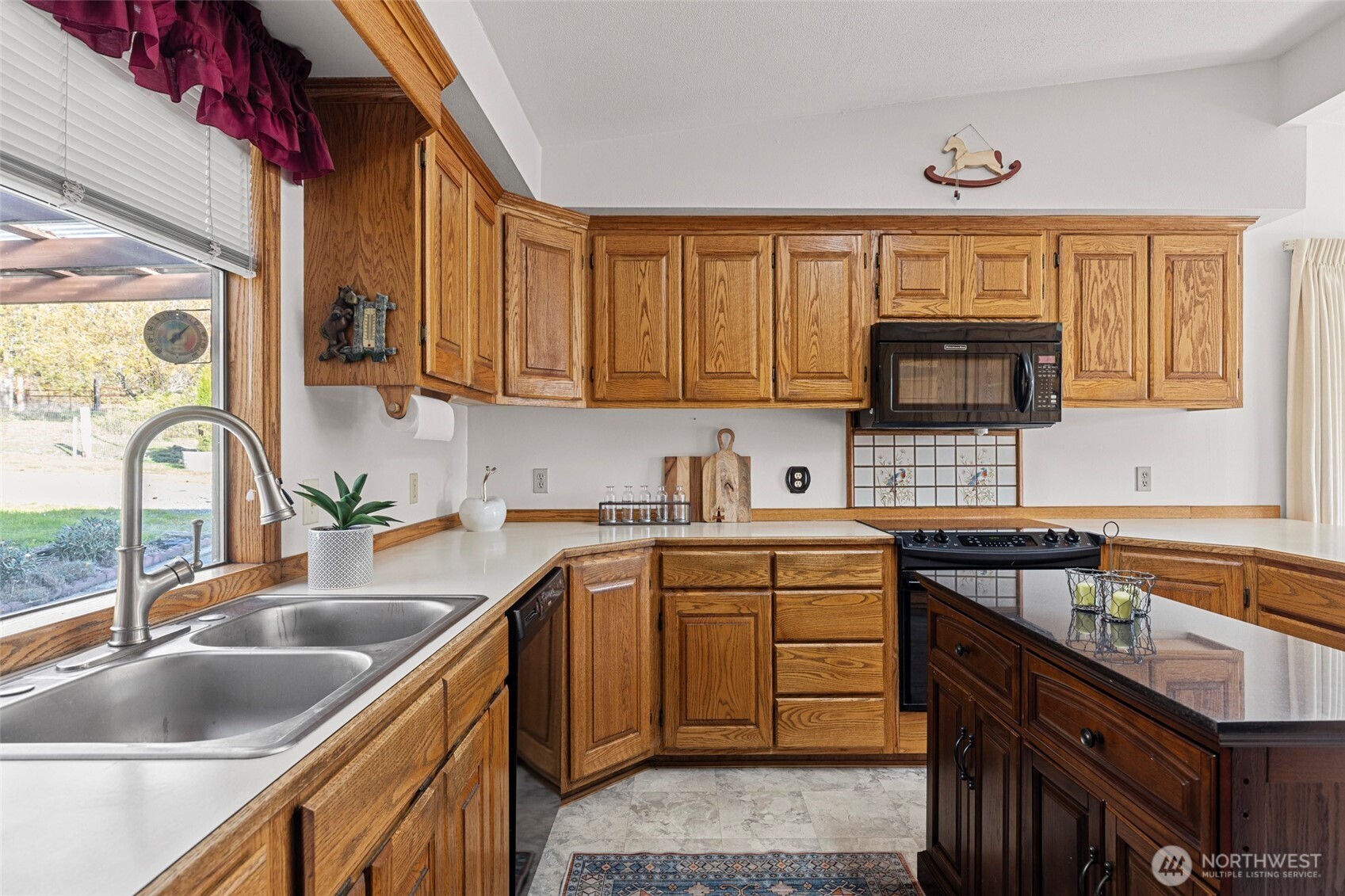 288 Torrence Lane Oak Harbor, WA 98277 - Photo 15 of 39 a kitchen with a sink stove top oven and cabinets