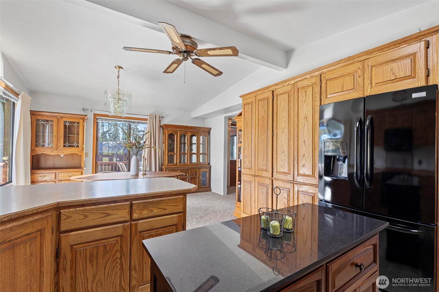 288 Torrence Lane Oak Harbor, WA 98277 - Photo 17 of 39 a kitchen with stainless steel appliances granite countertop a sink refrigerator and cabinets