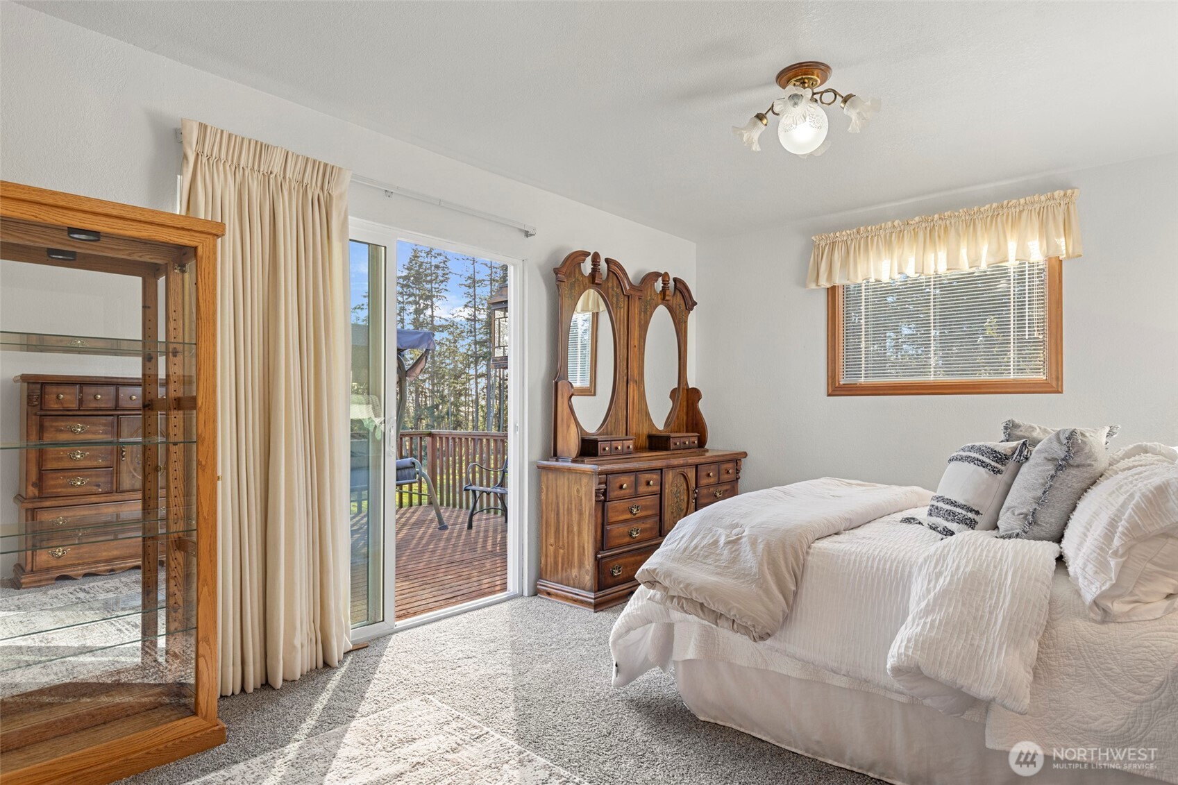 288 Torrence Lane Oak Harbor, WA 98277 - Photo 22 of 39 a bedroom with a bed and a chandelier