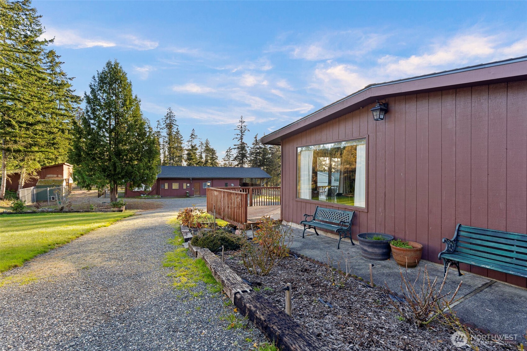 288 Torrence Lane Oak Harbor, WA 98277 - Photo 24 of 39 a backyard of a house with barbeque oven table and chairs