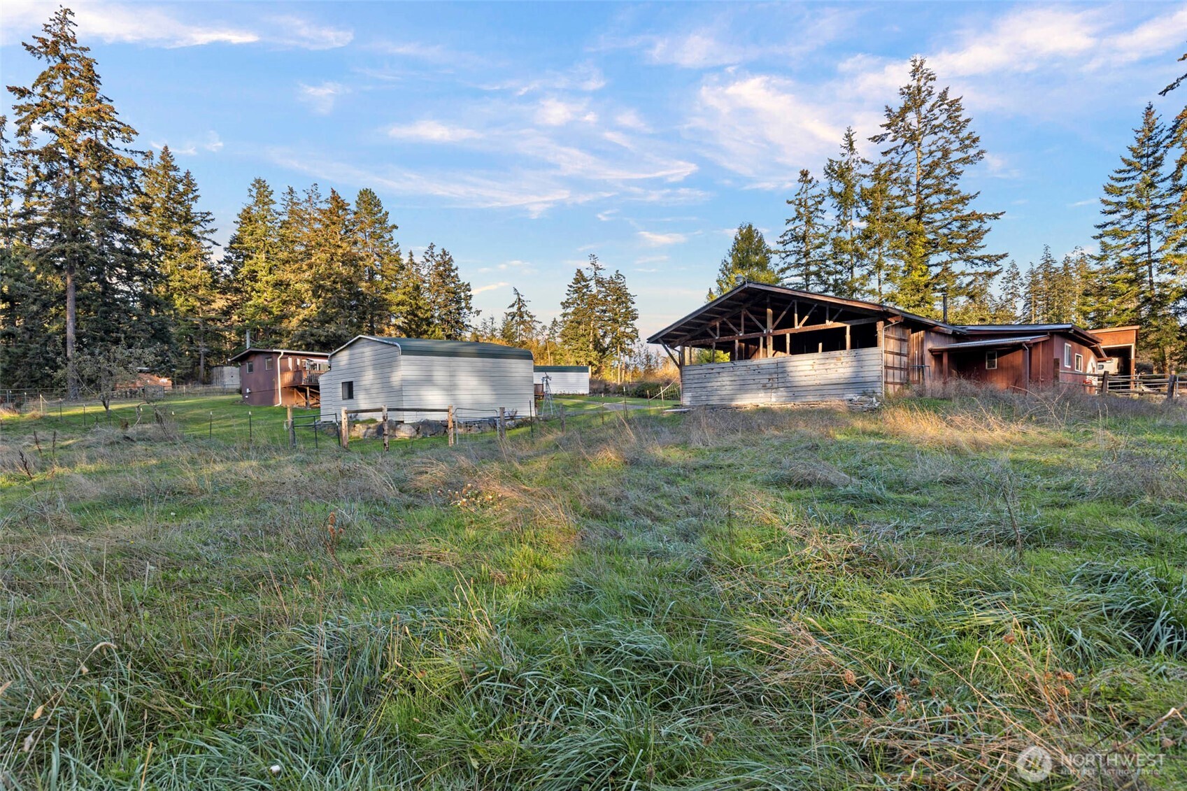288 Torrence Lane Oak Harbor, WA 98277 - Photo 33 of 39 a view of a house with a yard and sitting area