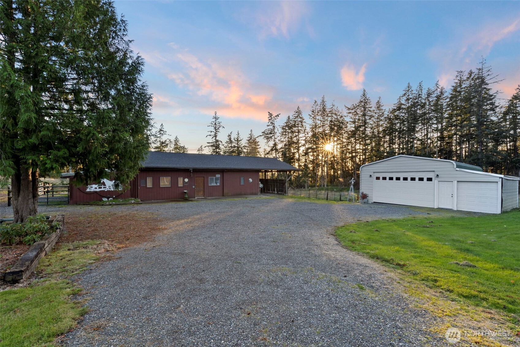 288 Torrence Lane Oak Harbor, WA 98277 - Photo 37 of 39 a view of a big house with a yard and large trees