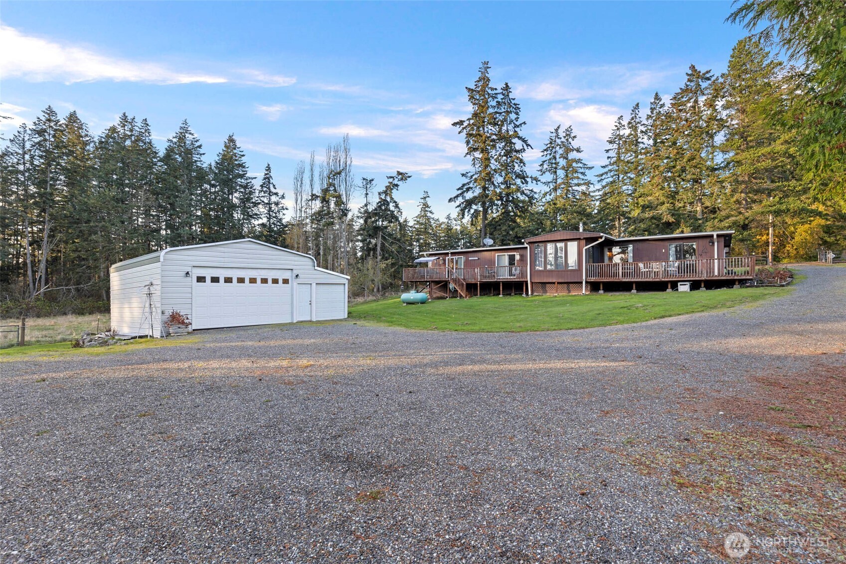 288 Torrence Lane Oak Harbor, WA 98277 - Photo 38 of 39 a view of a house with a yard and trees