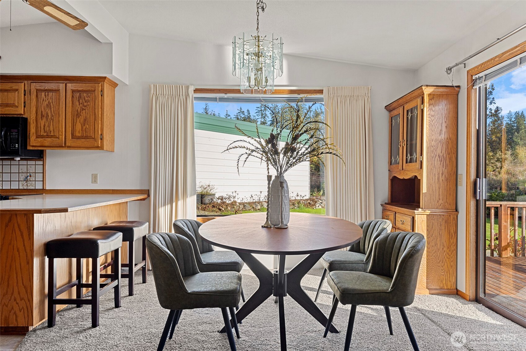 288 Torrence Lane Oak Harbor, WA 98277 - Photo 10 of 39 a view of a dining room with furniture and a chandelier