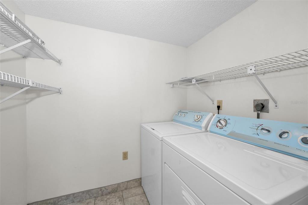 2687 Pine Ridge Way South, Unit B2 Palm Harbor, FL 34684 - Photo 28 of 68 a utility room with dryer and washer