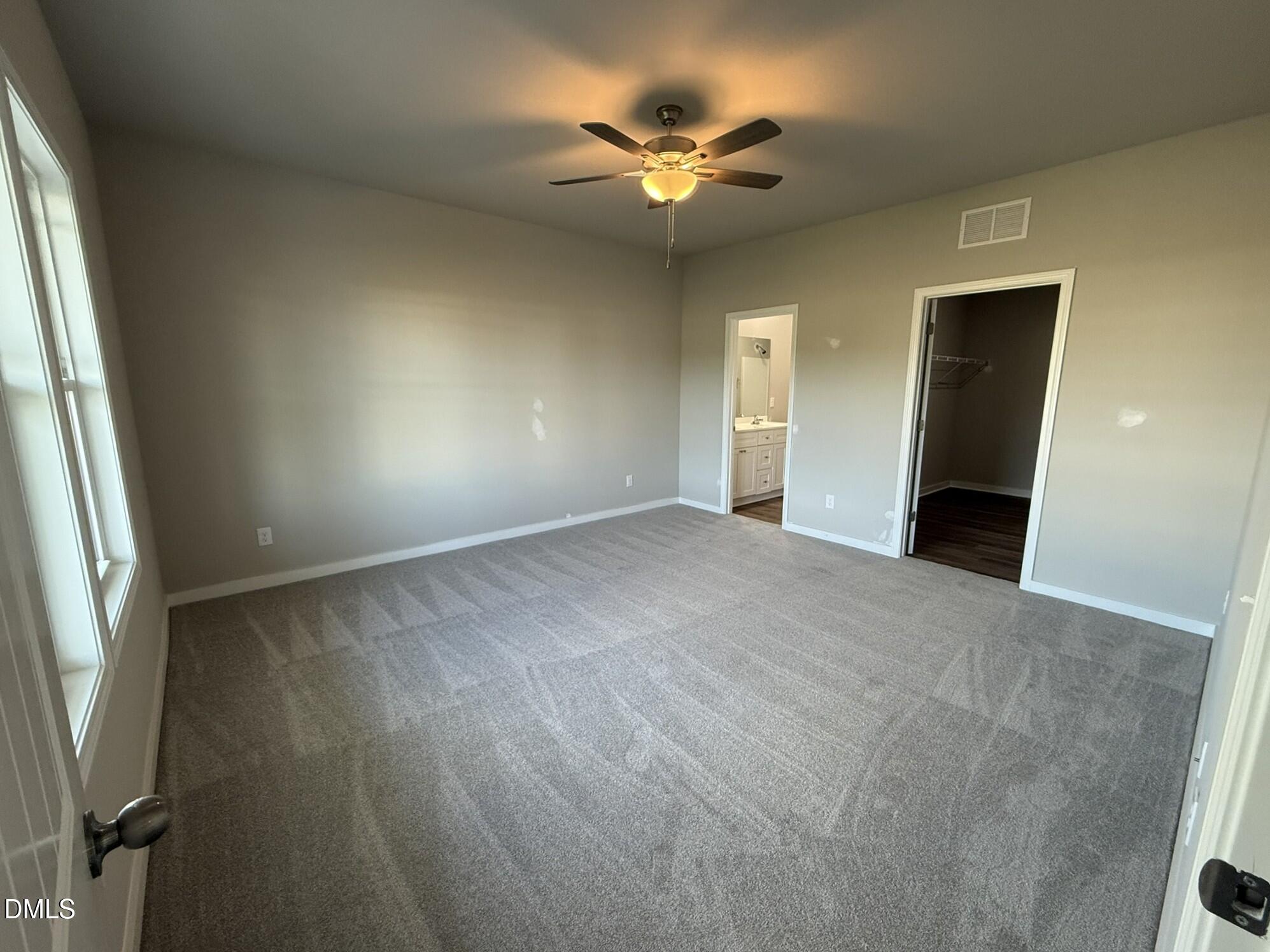 180 Jacobs Ridge Drive Four Oaks, NC 27524 - Photo 12 of 20 wooden floor in an empty room with a window