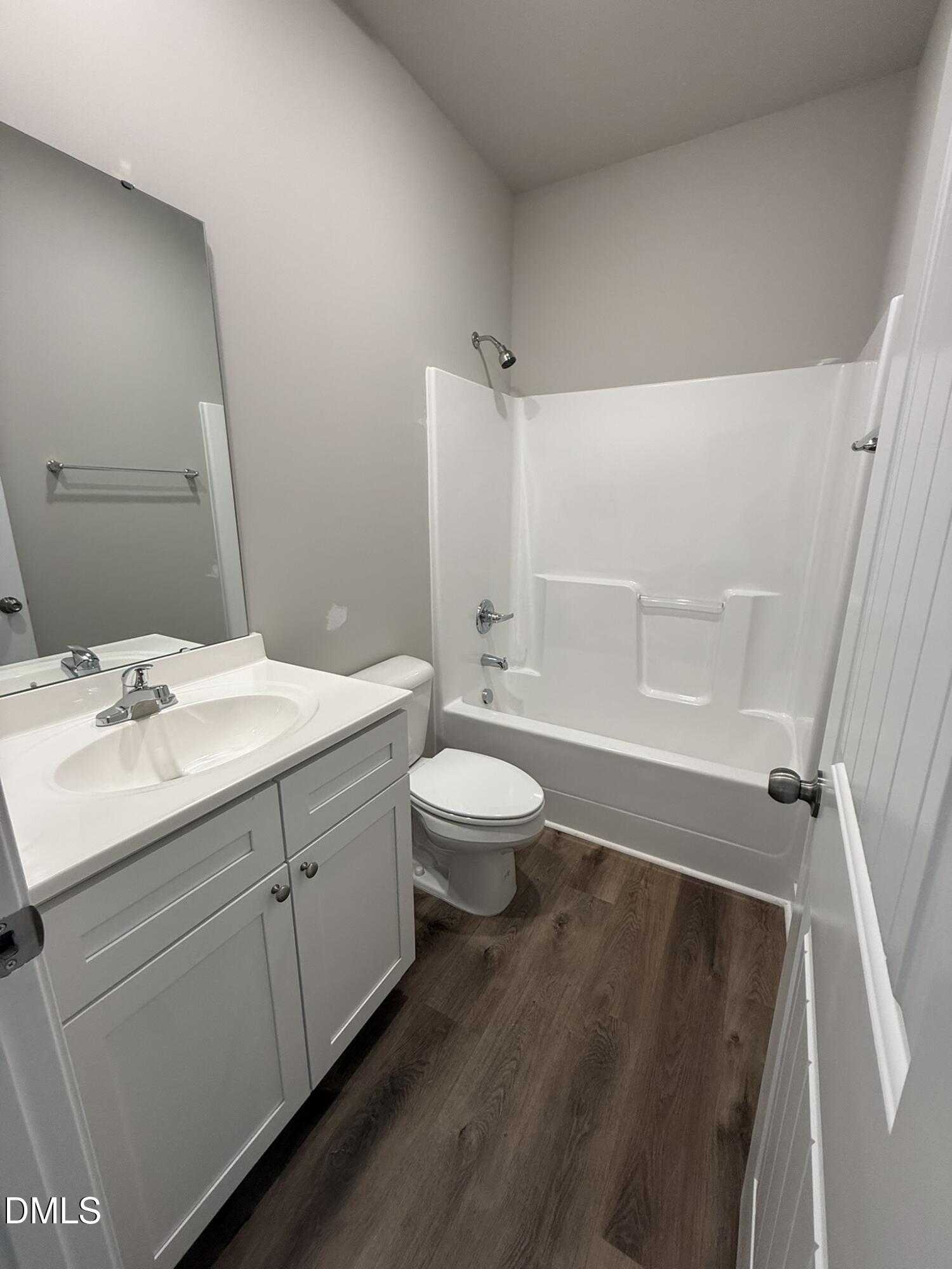 180 Jacobs Ridge Drive Four Oaks, NC 27524 - Photo 17 of 20 a bathroom with a sink a toilet and shower