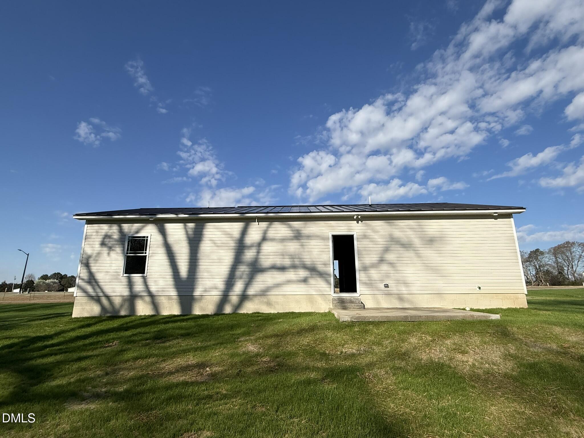 180 Jacobs Ridge Drive Four Oaks, NC 27524 - Photo 18 of 20 a view of a back yard from a room