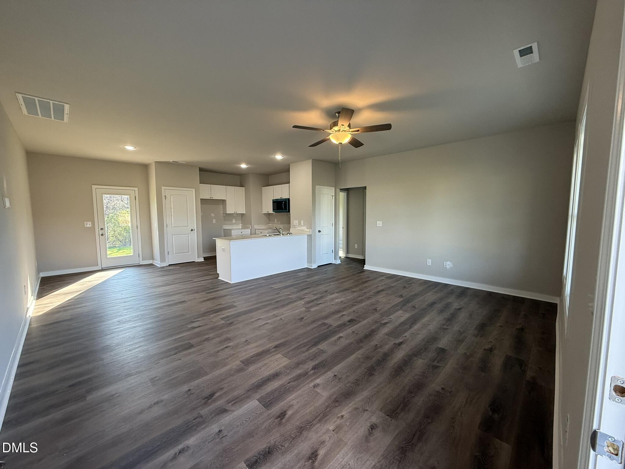 180 Jacobs Ridge Drive Four Oaks, NC 27524 - Photo 6 of 20 wooden floor in an empty room with a window