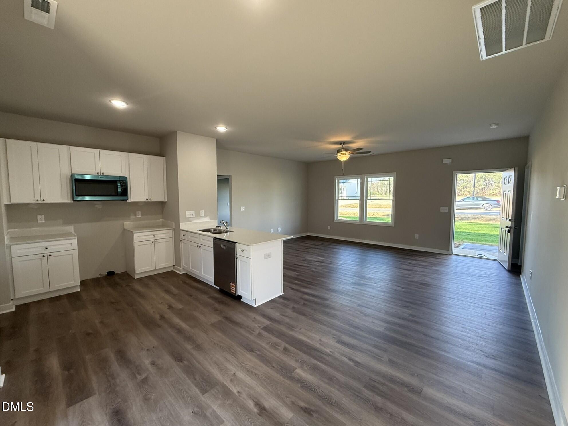 180 Jacobs Ridge Drive Four Oaks, NC 27524 - Photo 8 of 20 a view of a kitchen with kitchen island and stainless steel appliances