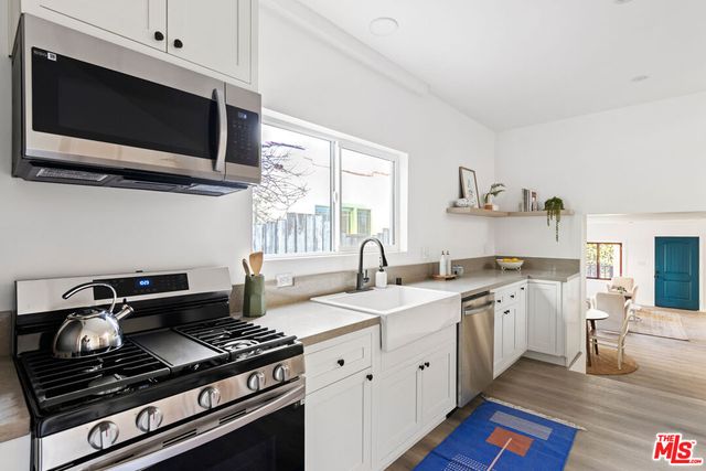 a kitchen with a stove and a microwave