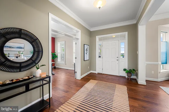 a living room with furniture a large window and a flat screen tv