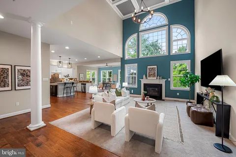 a room with fridge and a book shelf