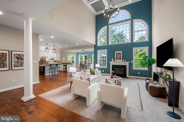 a room with fridge and a book shelf