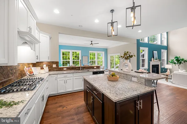 a bedroom with a bed and a lamp on dresser