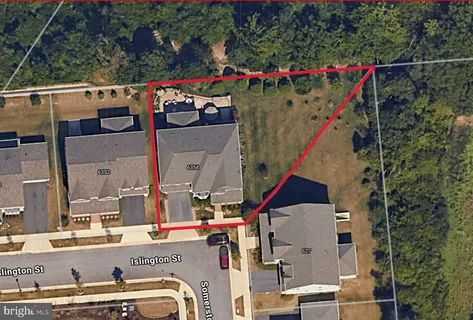 a view of a patio with couches and a potted plant on a table and chairs
