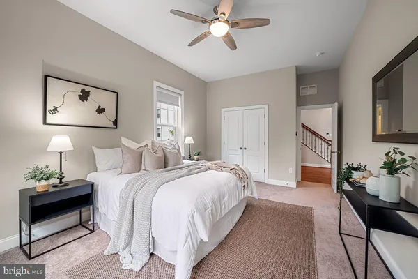 a bathroom with a granite countertop sink a mirror and a shower