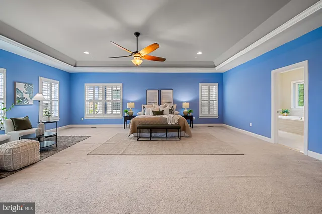 a view of a patio with couches table and chairs and potted plants
