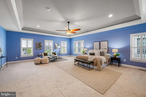 a view of a patio with a table and chairs under an umbrella
