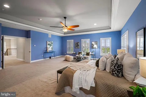 a view of a patio with table and chairs under an umbrella