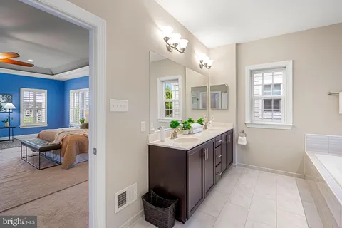 a front view of a house with a yard table and chairs