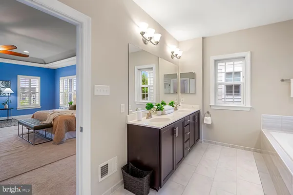 a front view of a house with a yard table and chairs