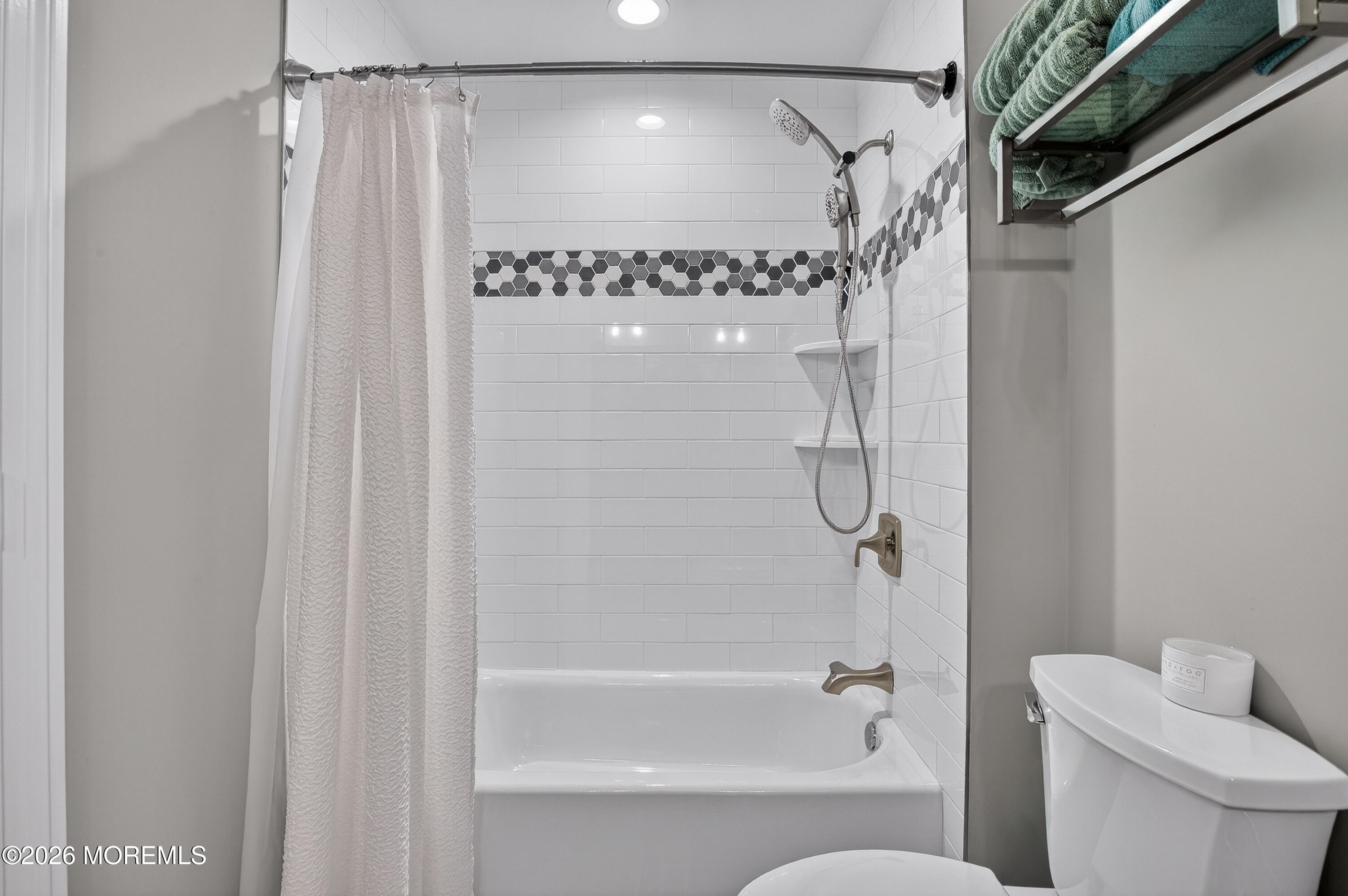 27 5th Street Highlands, NJ 07732 - Photo 26 of 62 a bathroom with a shower and a toilet