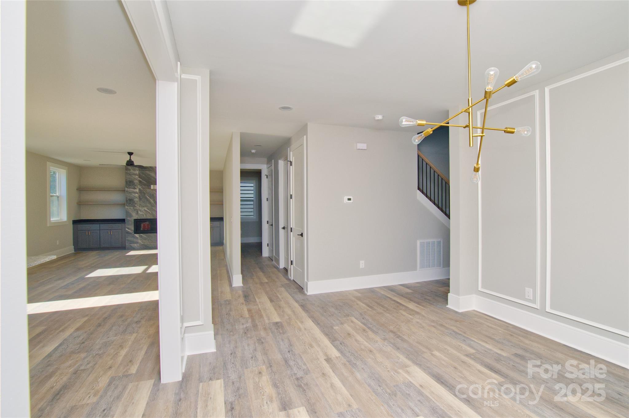 3905 Plainview Road Charlotte, NC 28208 - Photo 13 of 45 a view of a hallway with wooden floor and a bathroom
